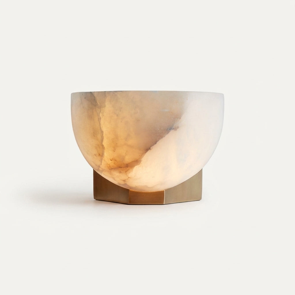 Brass and Alabaster Disc Sconce, switched on against a plain studio background