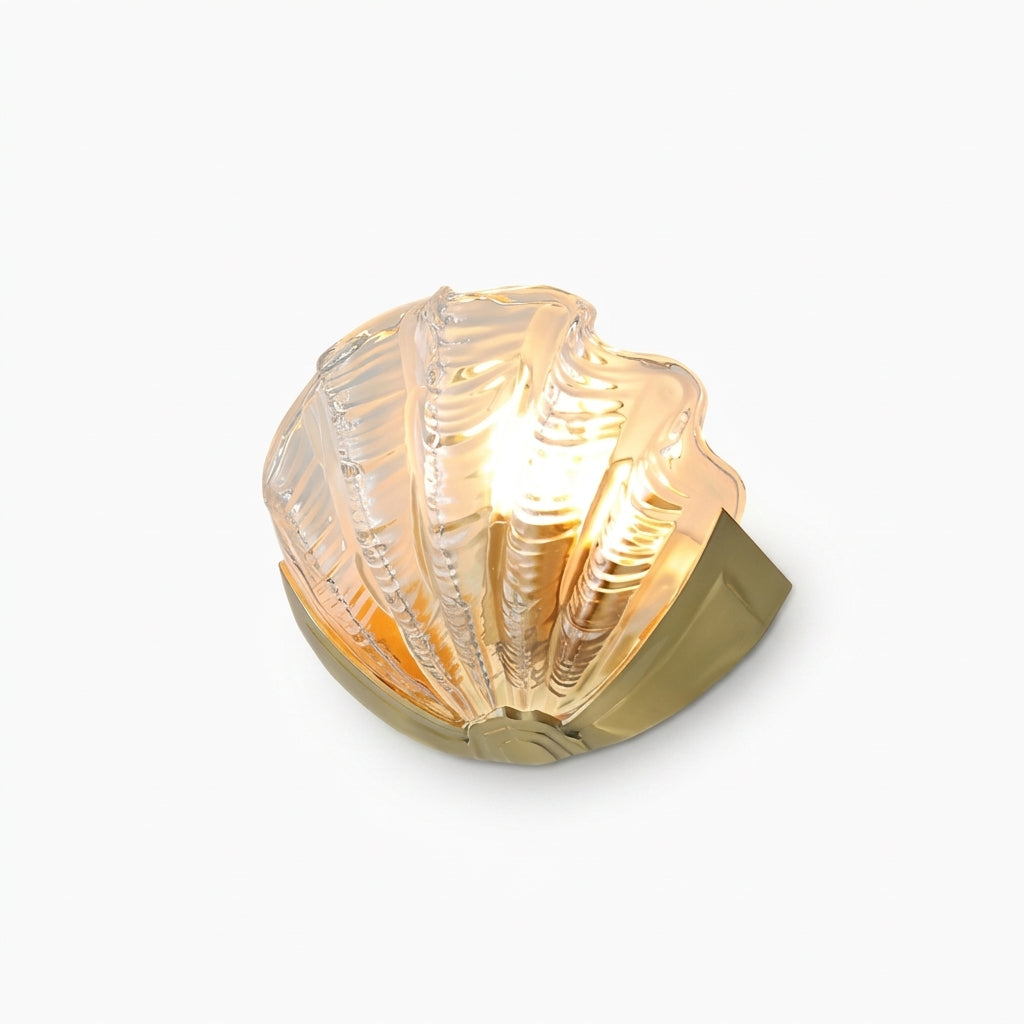 Seashell Glass and Brass Wall Sconce, switched on against a plain studio background