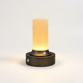Bronze and Alabaster Cordless Lamp, switched on against a plain studio background