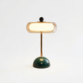 Amber Glass Tiered Cordless Lamp, switched on against a plain studio background