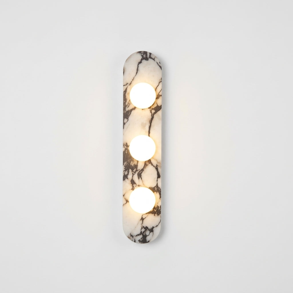 Marble and Opal Glass Wall Light, switched on against a plain studio background
