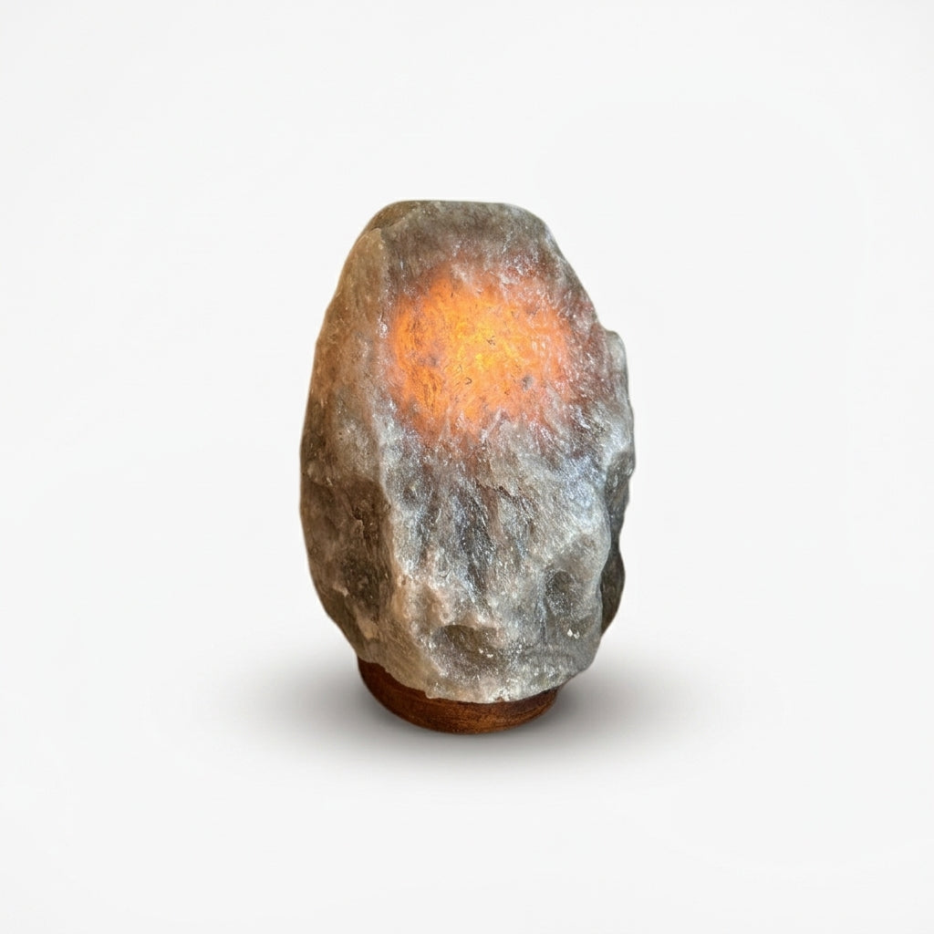 Salt Stone Table Lamp, switched on against a plain studio background