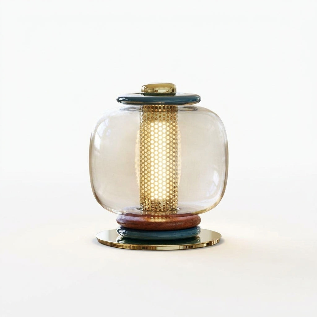 Polished Metal and Glass Table Lamp, switched on against a plain studio background