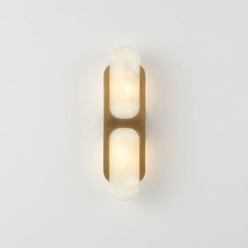 Alabaster Tube Wall Lamp, switched on against a plain studio background