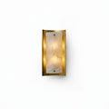 Tall Alabaster and Brass Wall Lamp, switched on against a plain studio background