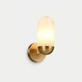 Alabaster Capsule Wall Light, switched on against a plain studio background