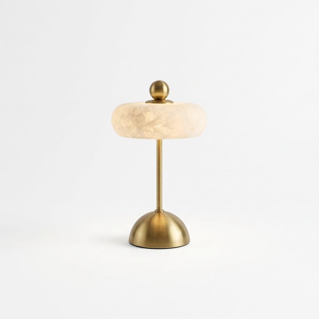 Alabaster Disc Table Lamp, switched on against a plain studio background