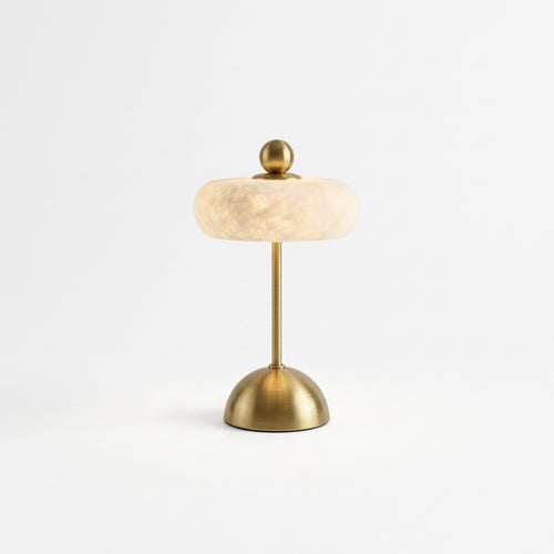 Alabaster Disc Table Lamp, switched on against a plain studio background