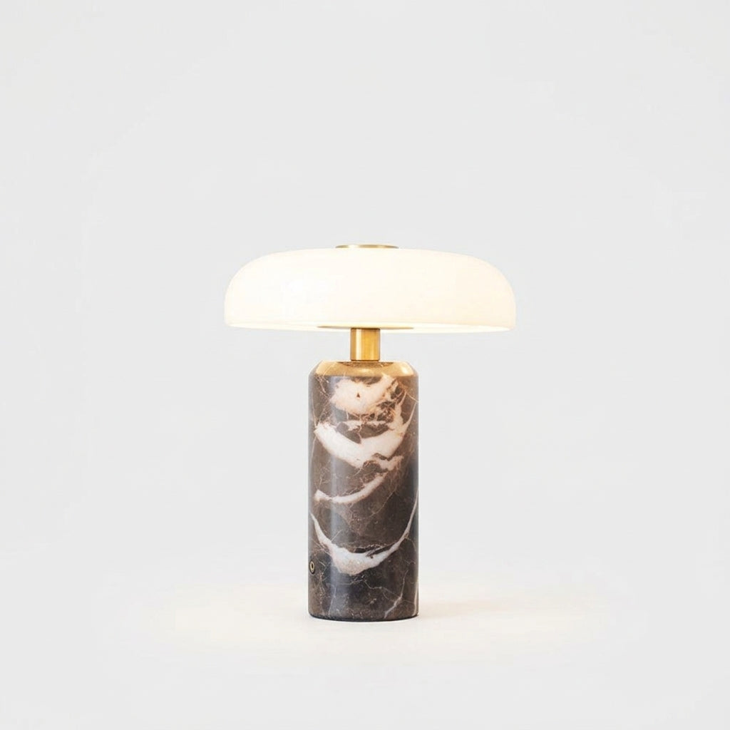 Marble and Glass Portable Lamp, switched on against a plain studio background