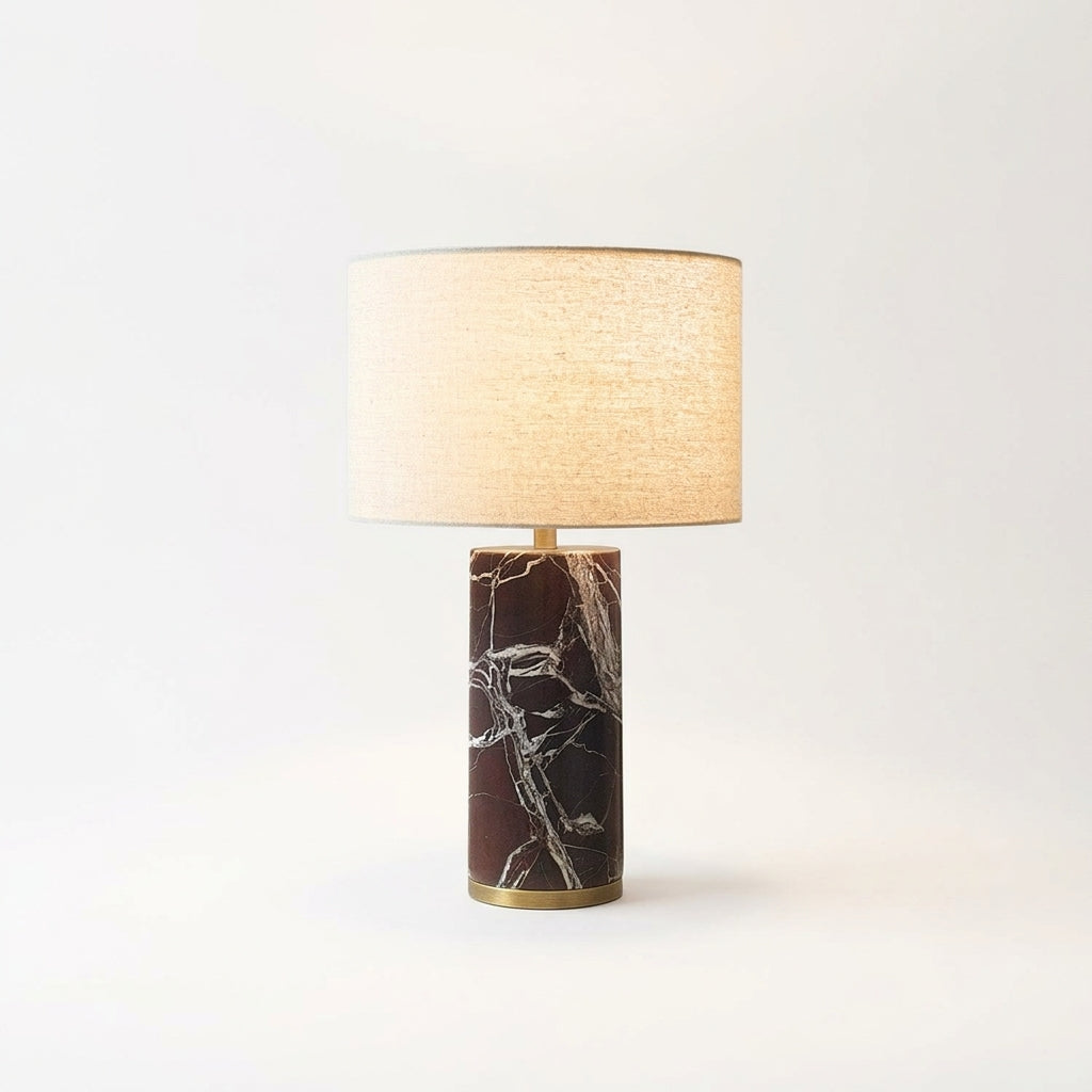 Veined Marble Table Lamp, switched on against a plain studio background