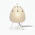 Rice Paper Tripod Table Lamp, switched on against a plain studio background
