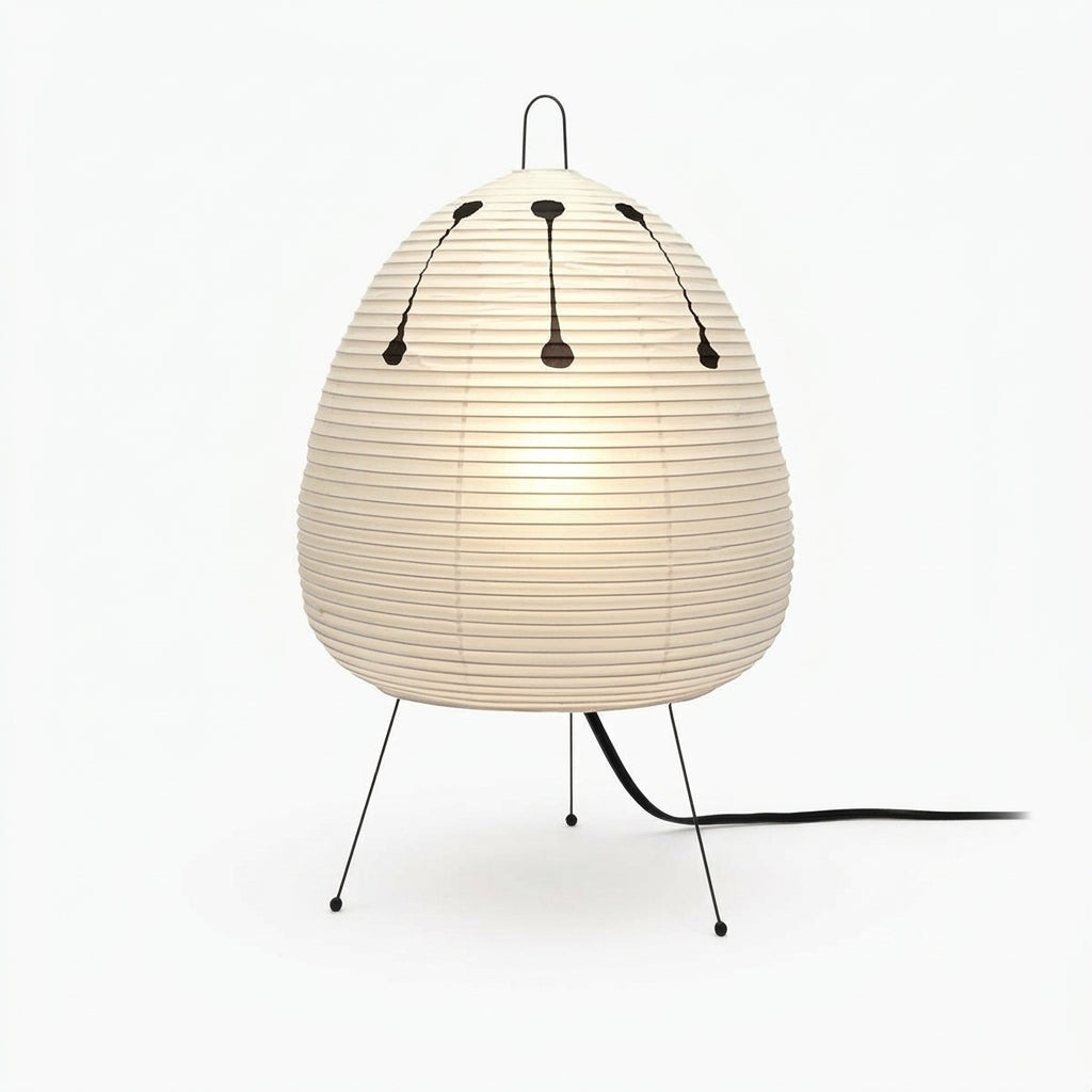 Rice Paper Tripod Table Lamp, switched on against a plain studio background