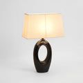 Ceramic and Fabric Table Lamp, switched on against a plain studio background