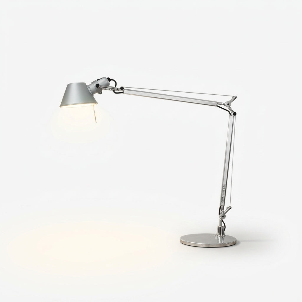 Articulated Aluminum Desk Lamp, switched on against a plain studio background