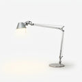 Articulated Aluminum Desk Lamp, switched on against a plain studio background
