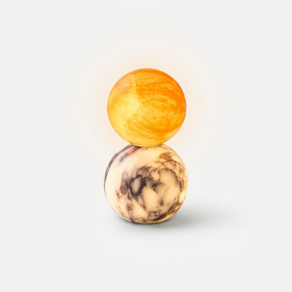Marble and Alabaster Table Lamp, switched on against a plain studio background