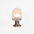 Ribbed Glass Cordless Lamp, switched on against a plain studio background