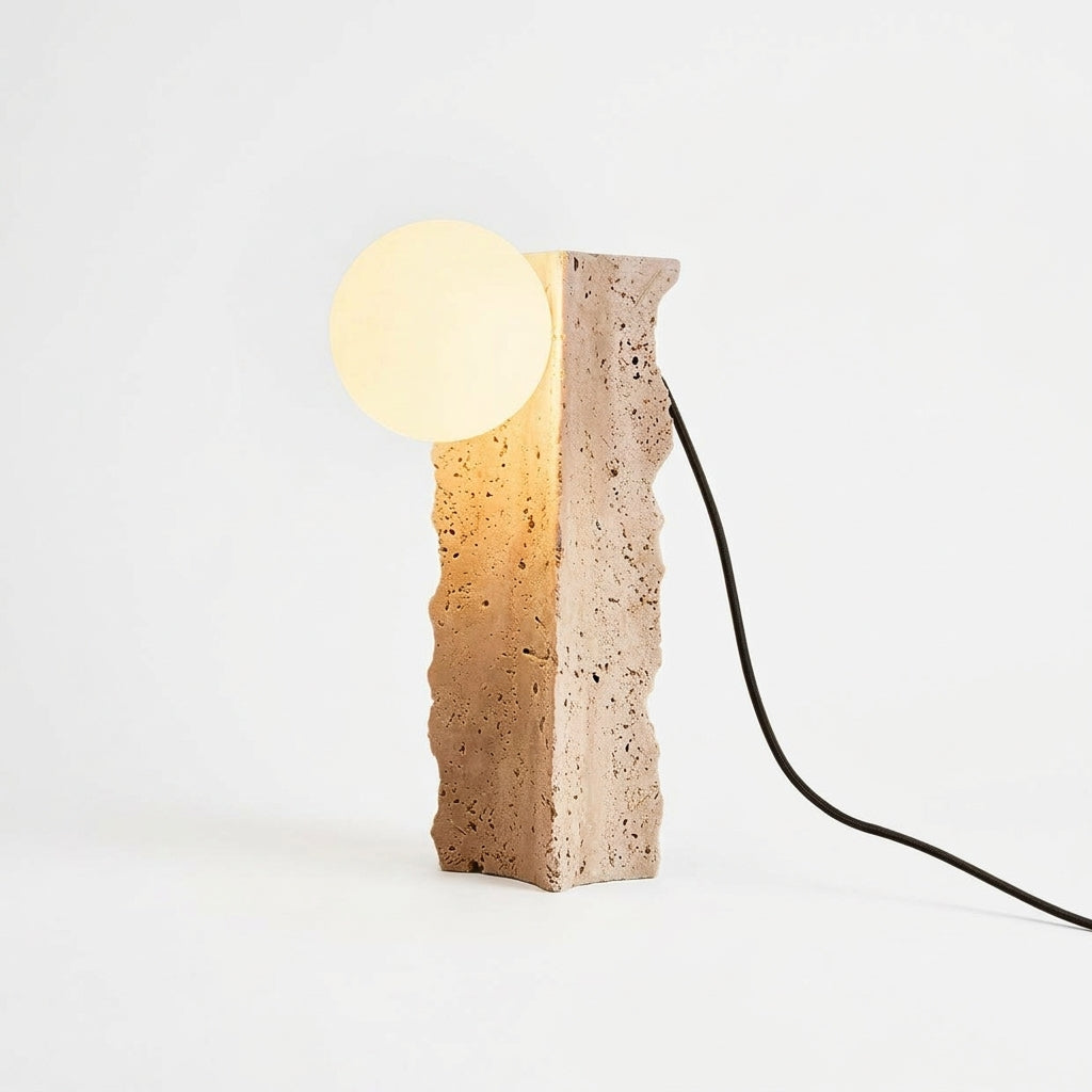 Travertine Column Table Lamp, switched on against a plain studio background