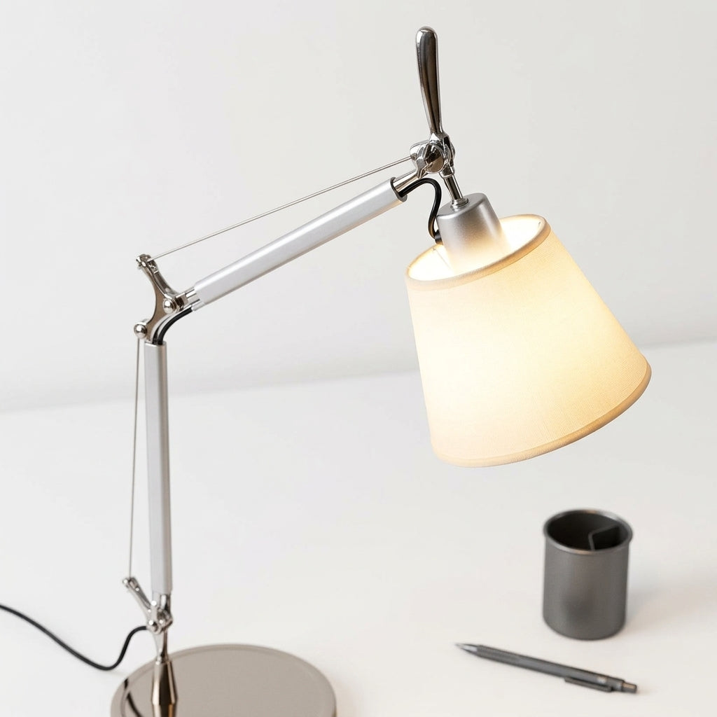Close detail of the stainless steel, aluminum, parchment shade on the Cantilever Parchment Task Lamp