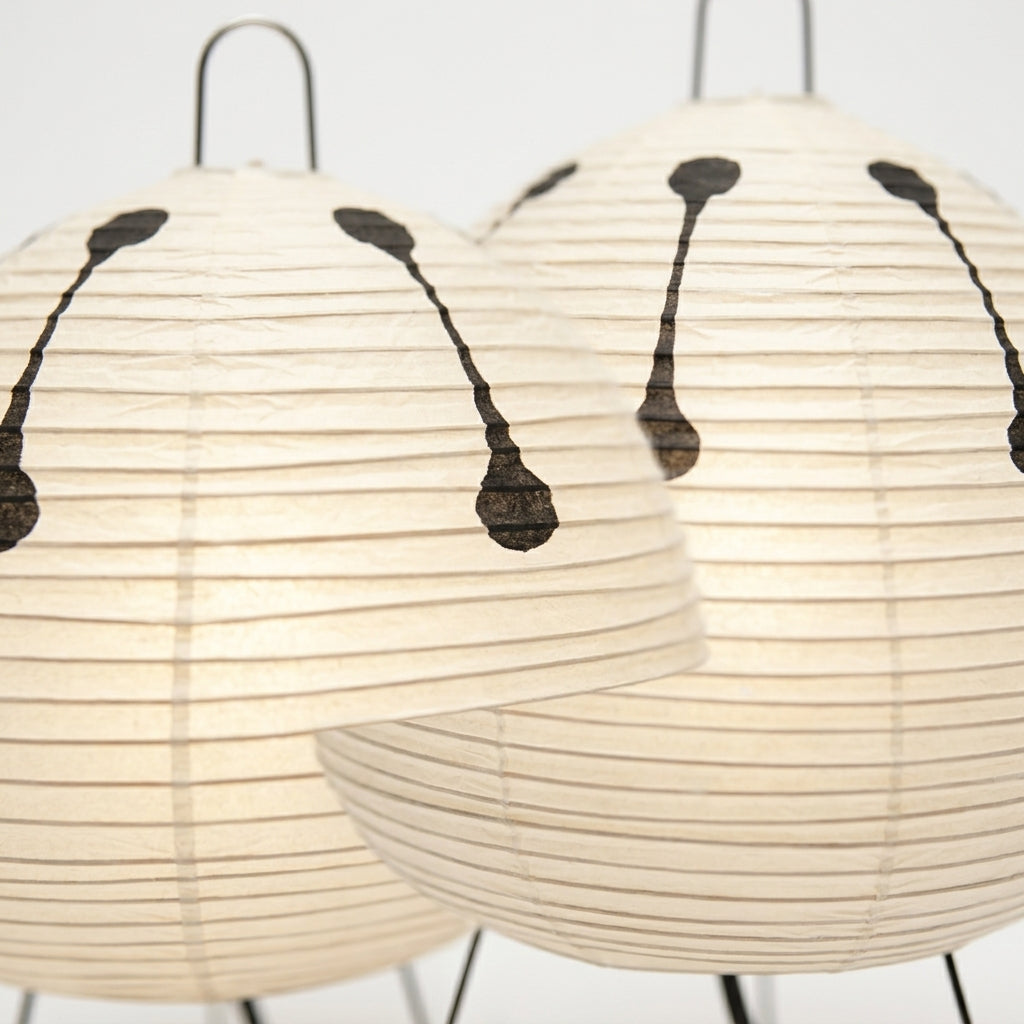 Close detail of the metal tripod, rice paper shade on the Rice Paper Tripod Table Lamp
