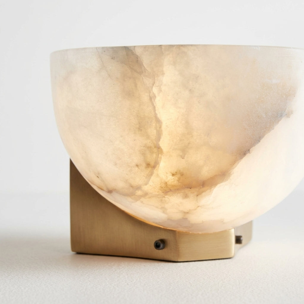 Close detail of the alabaster shade, brass on the Brass and Alabaster Disc Sconce