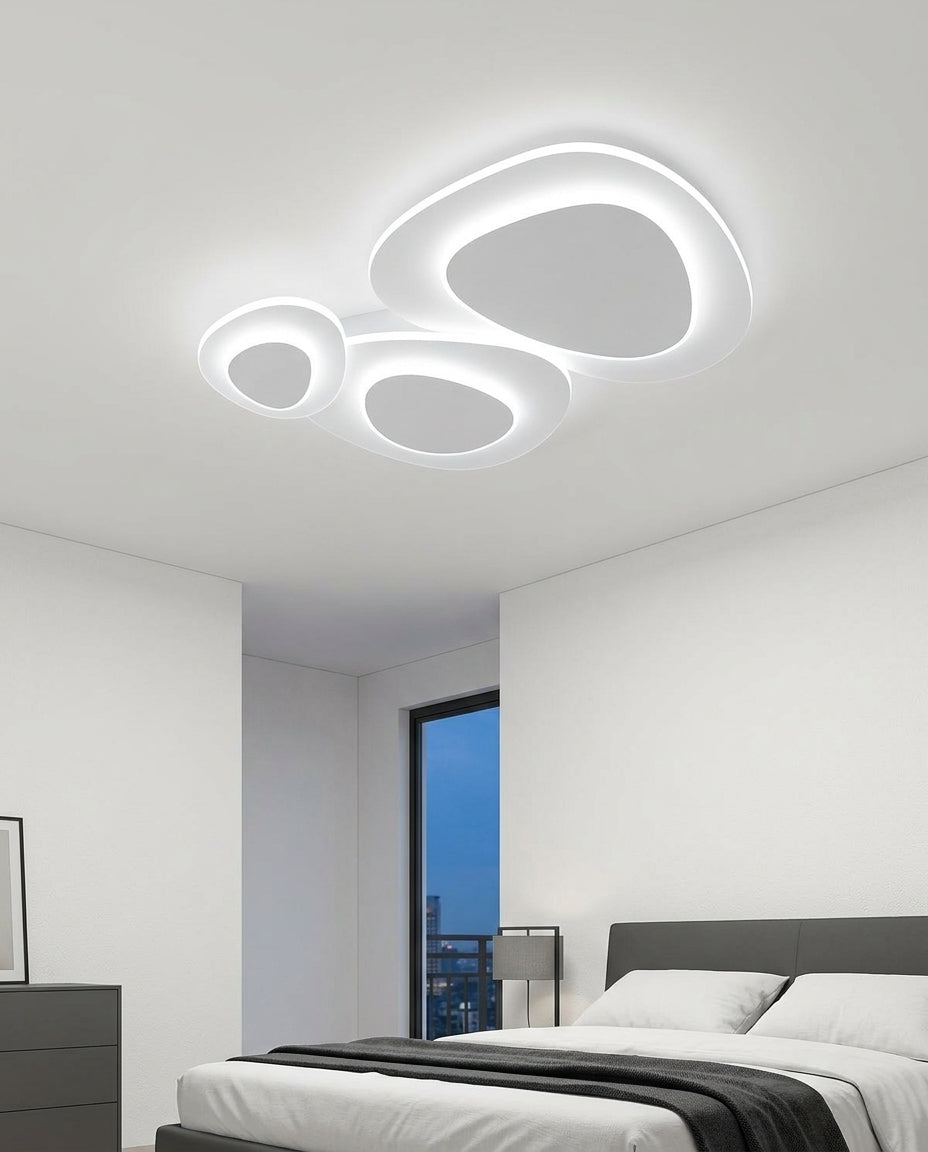 Nordic LED Flush Mount mounted on the ceiling of a calm modern bedroom, seen from below at a slight angle