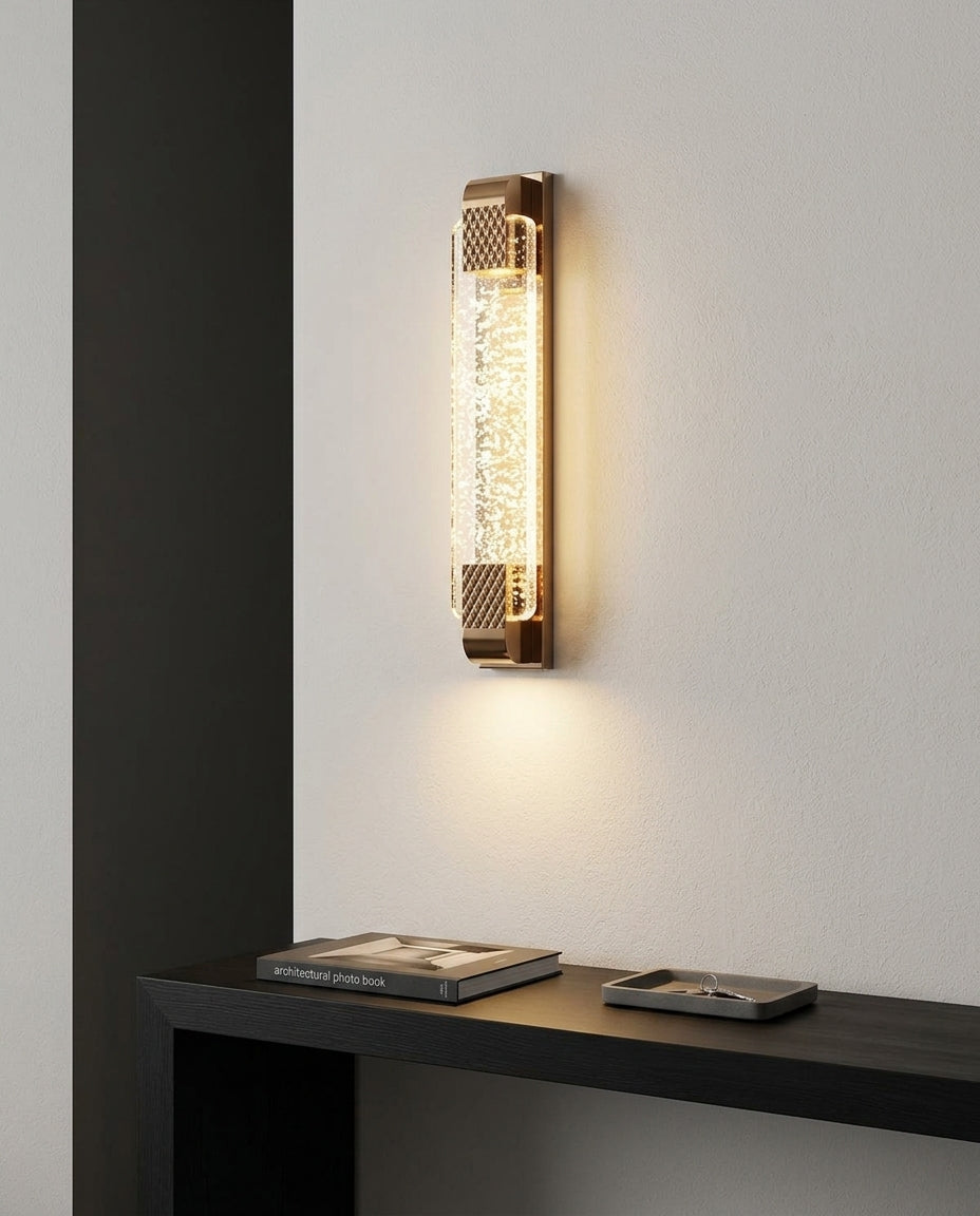 Crystal and Gold Rectangular Wall Light mounted on an off-white hallway wall above a low console, evening, warm pool of light on the wall
