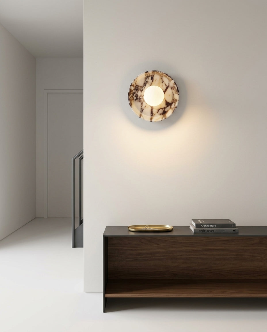 Purple Marble and Frosted Glass Wall Light mounted on an off-white hallway wall above a low console, evening, warm pool of light on the wall