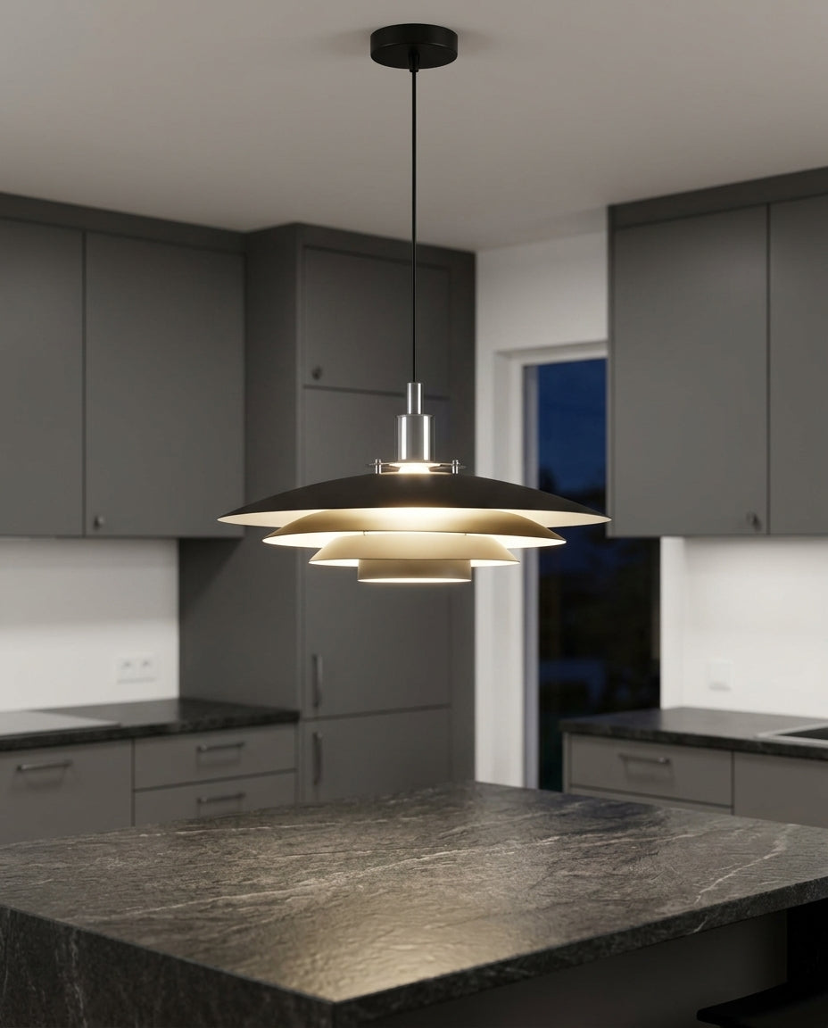 Tiered Metal Dome Pendant Light hanging above a kitchen island with a stone worktop, modern American kitchen, evening