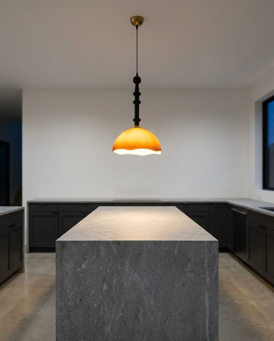 Retro Glass Dome Pendant Light hanging above a kitchen island with a stone worktop, modern American kitchen, evening