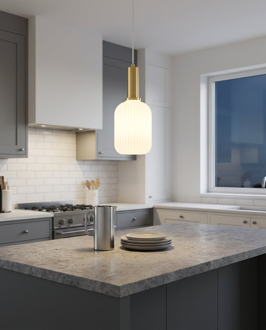 Bubble Glass Pendant Light hanging above a kitchen island with a stone worktop, modern American kitchen, evening