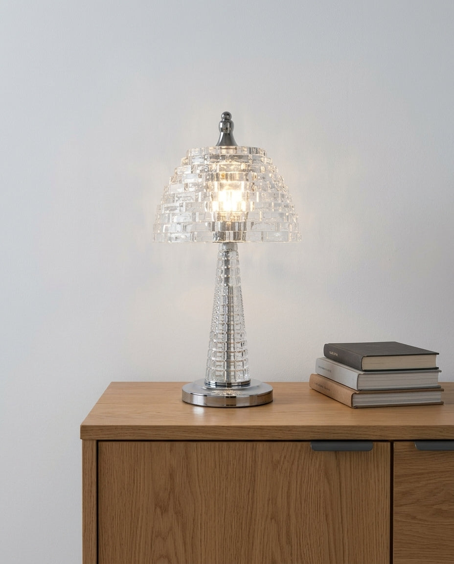 Crystal Glass Table Lamp on an oak sideboard against an off-white wall, evening, a small stack of books beside it