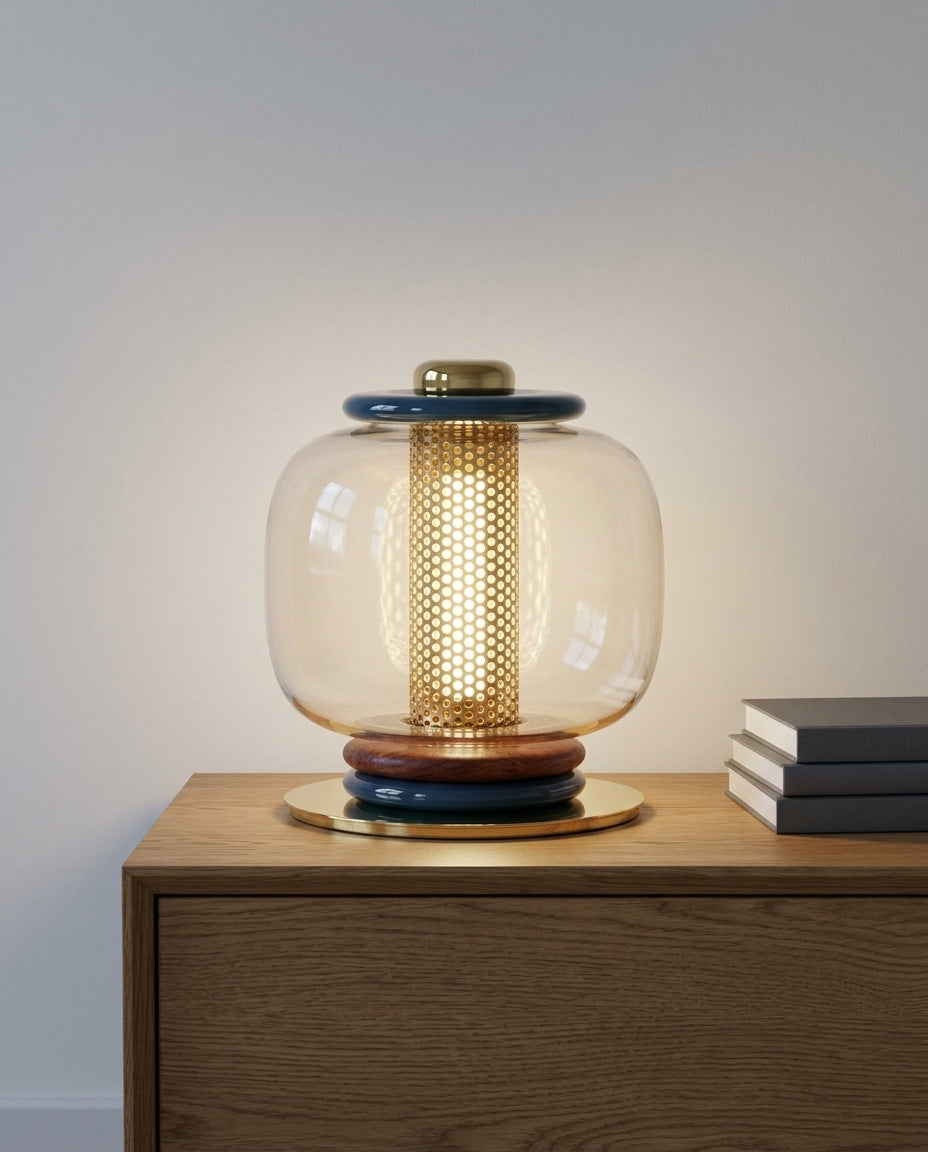 Polished Metal and Glass Table Lamp on an oak sideboard against an off-white wall, evening, a small stack of books beside it