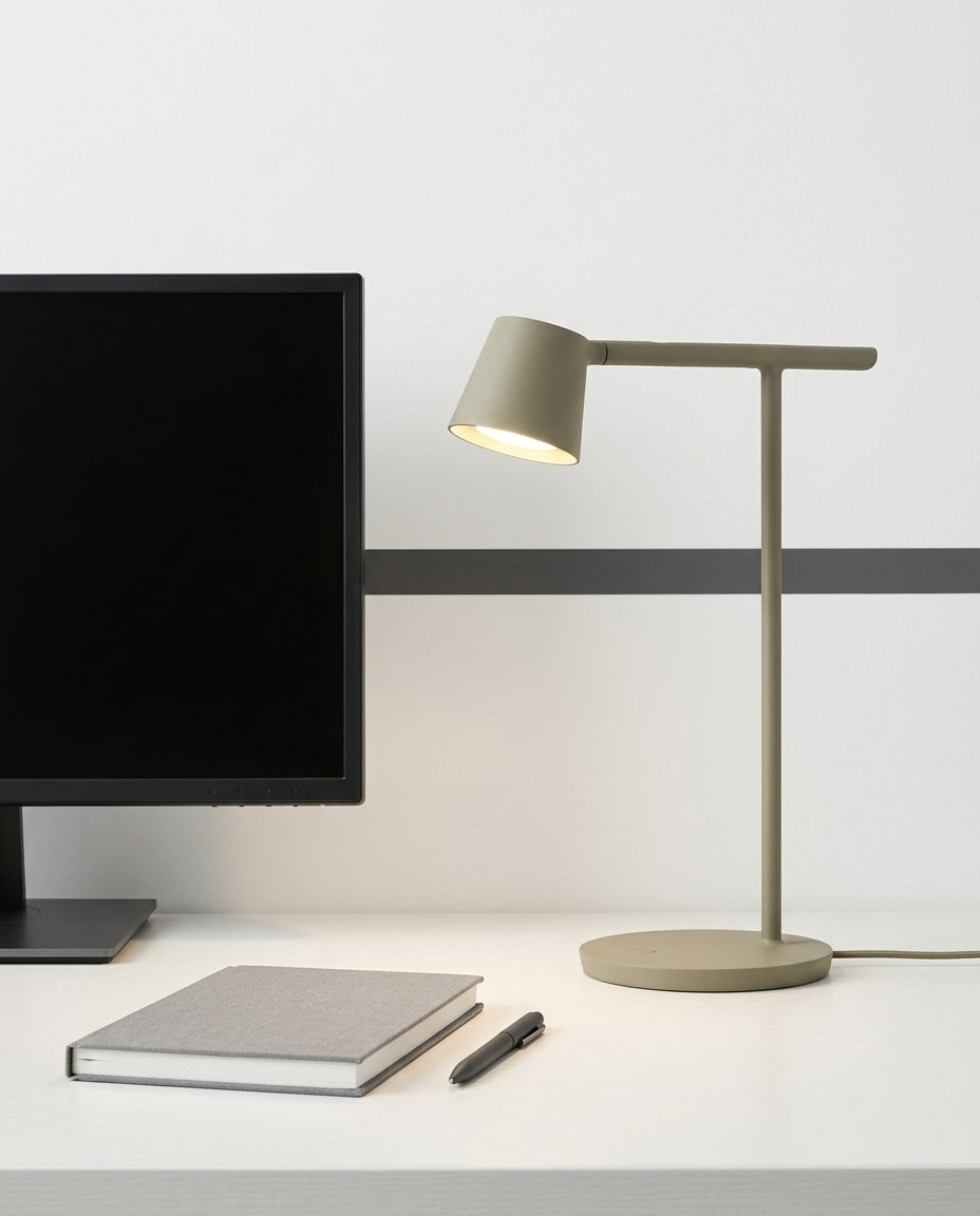 Adjustable Opal Diffuser Desk Lamp on a tidy home-office desk with a monitor and a notebook, task light pooled on the desk surface