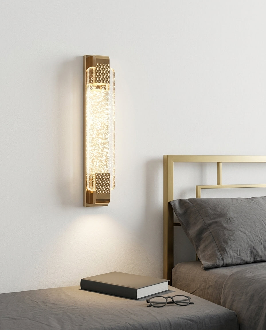Crystal and Gold Rectangular Wall Light mounted on the wall beside a bed in place of a bedside lamp, reading light angled down