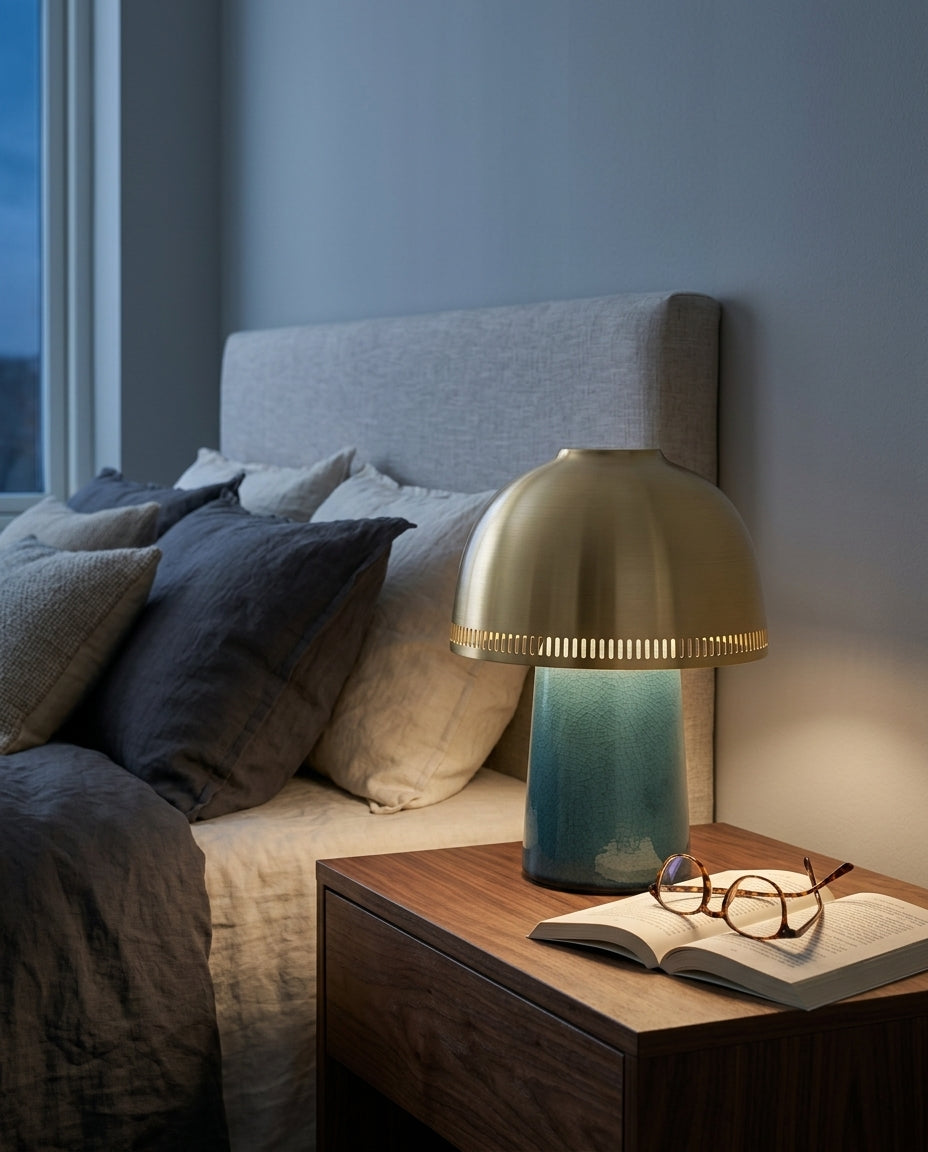 Ceramic Cordless Table Lamp on a bedside table beside a folded throw, warm evening light
