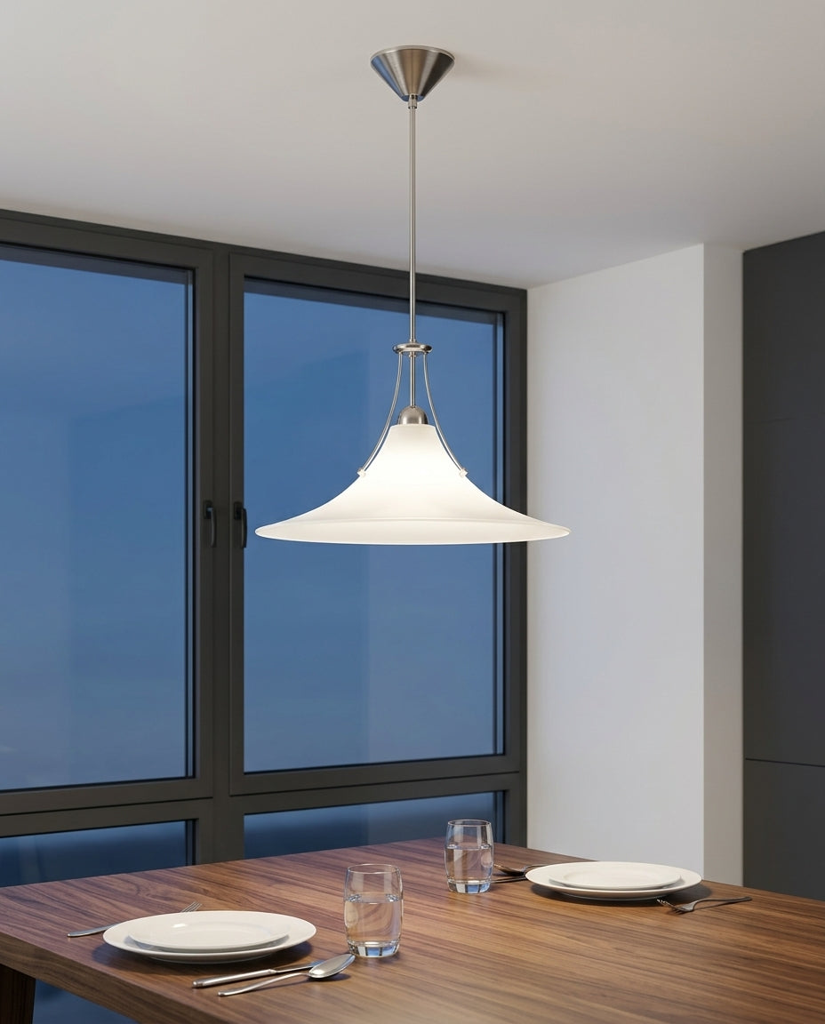 Minimalist Frosted Glass Pendant Light hanging above a walnut dining table set for two, blue-hour light through a large window