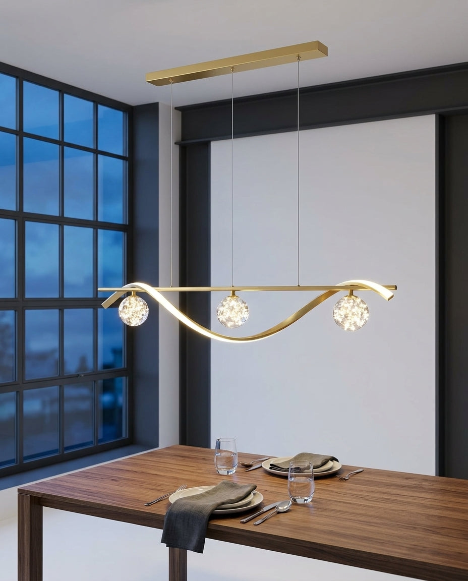 Globe and Metal Pendant hanging above a walnut dining table set for two, blue-hour light through a large window