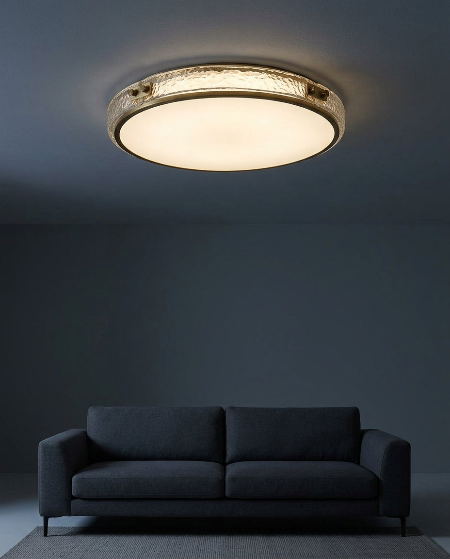 Brass and Crystal Ceiling Light mounted on the ceiling of a living room with a low sofa, evening