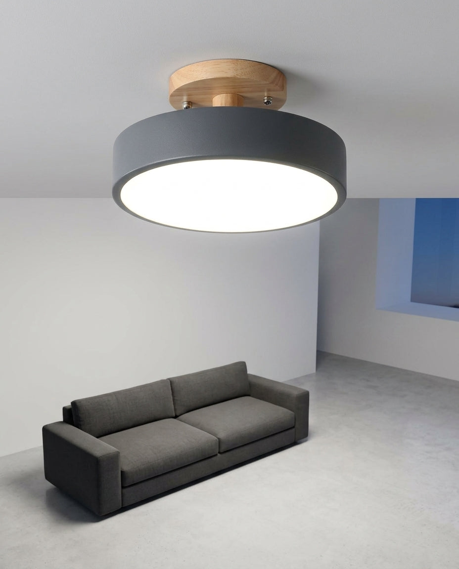 Wood and Acrylic Ceiling Light mounted on the ceiling of a living room with a low sofa, evening