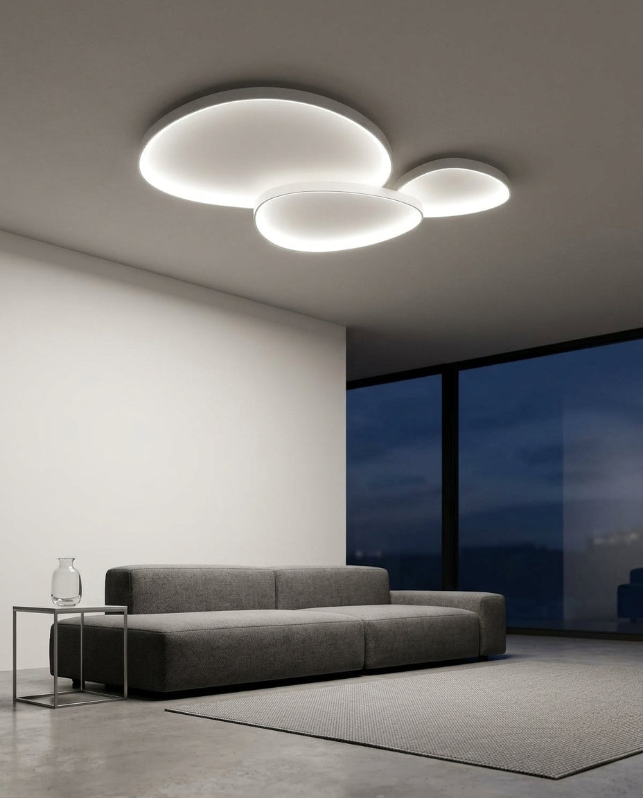Linear Metal Ceiling Light mounted on the ceiling of a living room with a low sofa, evening