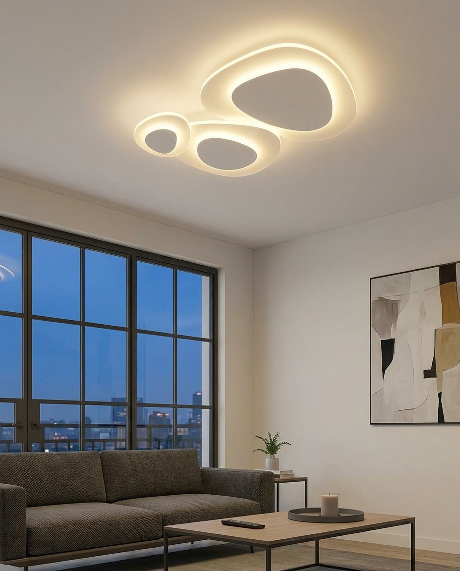 Nordic LED Flush Mount mounted on the ceiling of a living room with a low sofa, evening