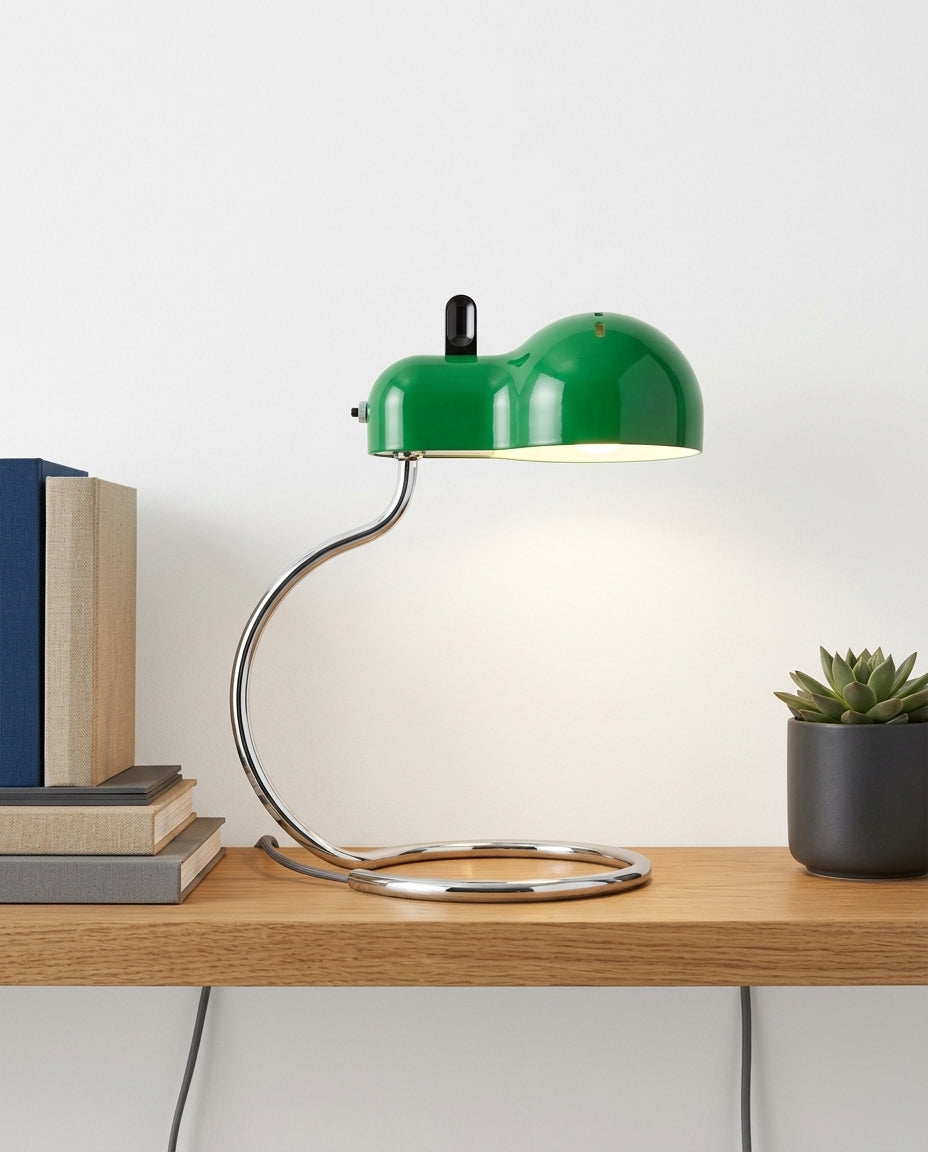 Industrial Dome Desk Lamp on an oak shelf beside a few hardback books and a small plant, evening