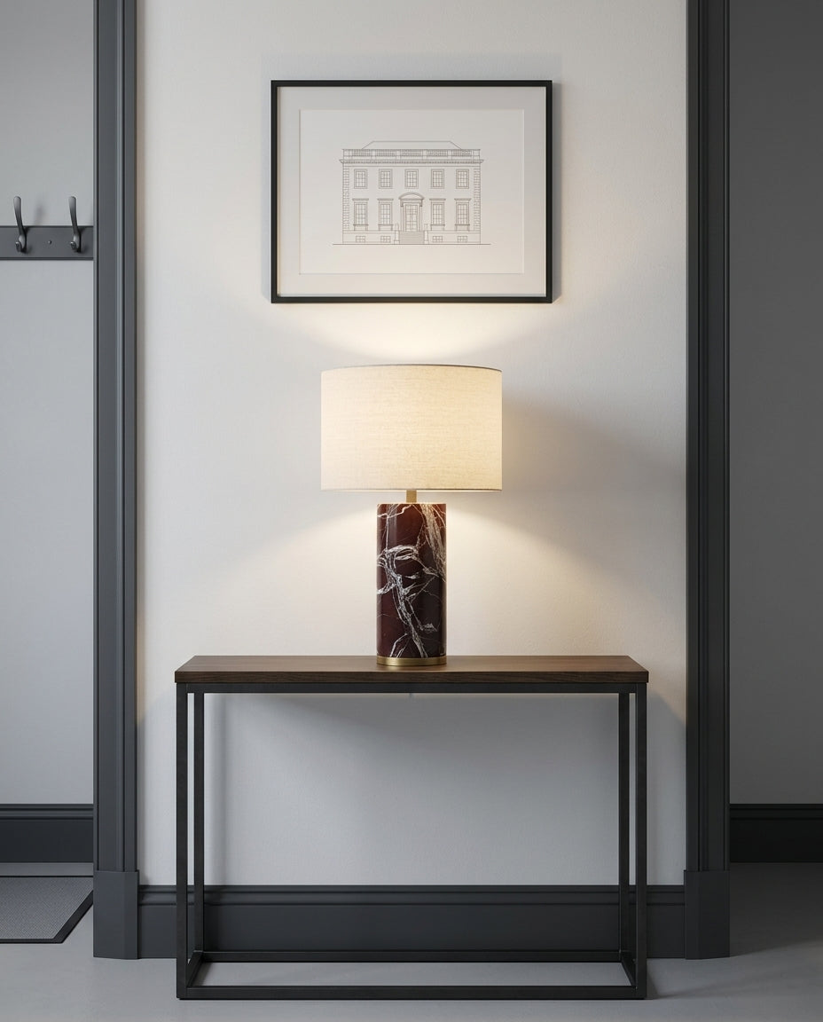 Veined Marble Table Lamp on an entryway console table below a framed print, evening