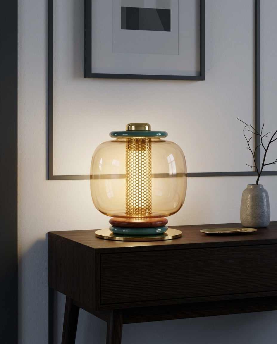 Polished Metal and Glass Table Lamp on an entryway console table below a framed print, evening