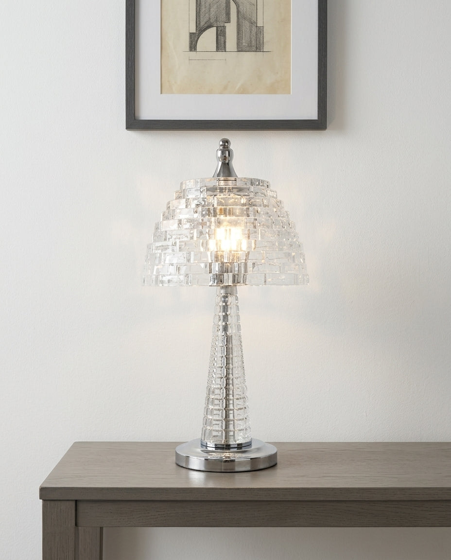 Crystal Glass Table Lamp on an entryway console table below a framed print, evening
