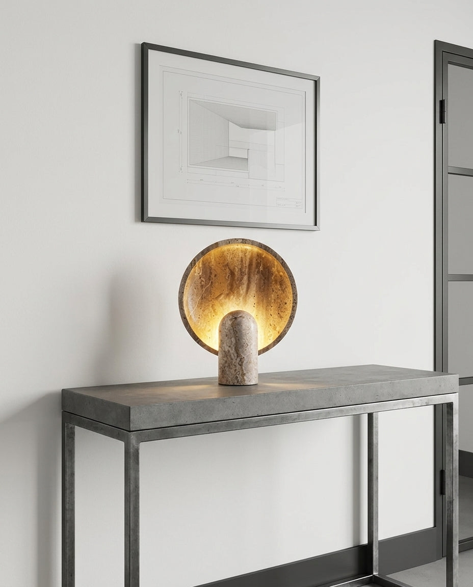 Travertine Table Lamp on an entryway console table below a framed print, evening