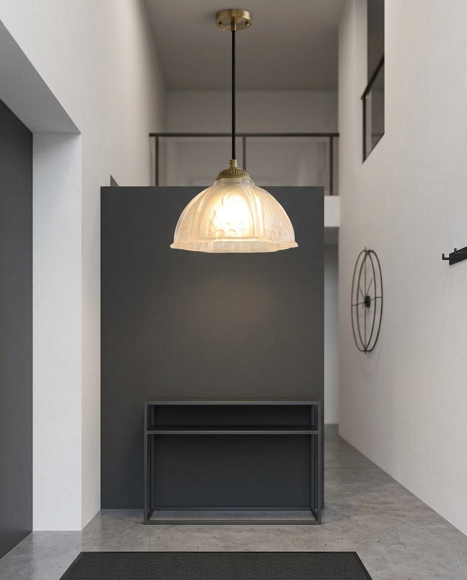 Scalloped Glass Petal Pendant Light hanging in a double-height entryway above a console table, evening