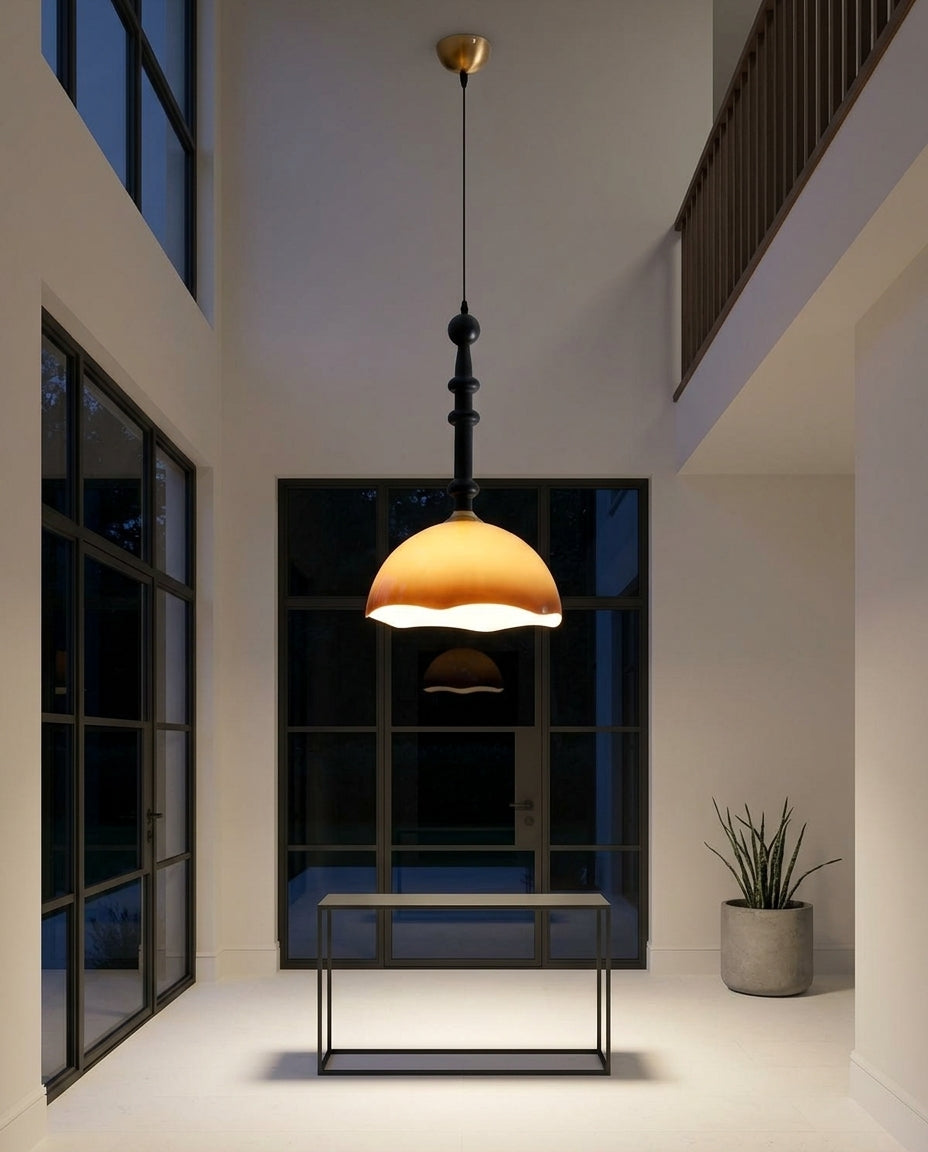 Retro Glass Dome Pendant Light hanging in a double-height entryway above a console table, evening