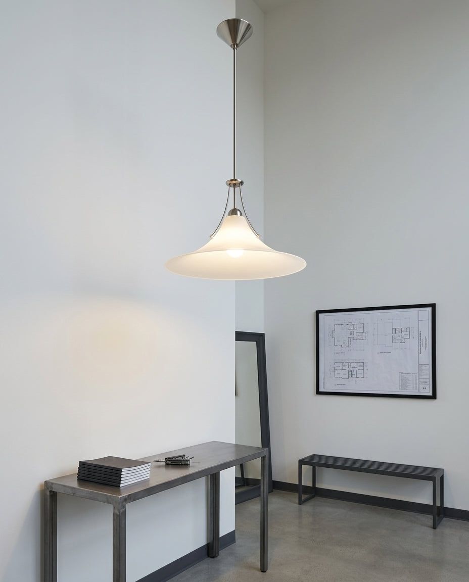 Minimalist Frosted Glass Pendant Light hanging in a double-height entryway above a console table, evening